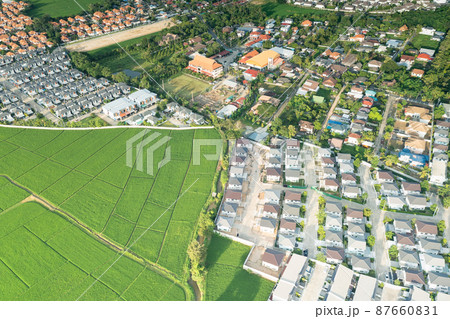 Landscape of green field and house in aerial view. 87660831