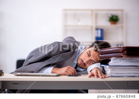 Young male employee in oversleeping concept 87660848