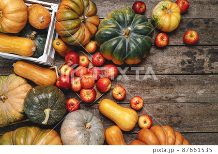 Colorful autumn background with pumpkins and apples 87661535