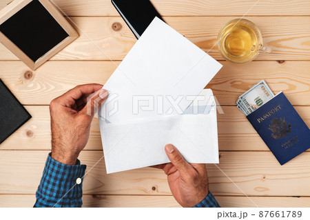 Passport with letter on desk background 87661789