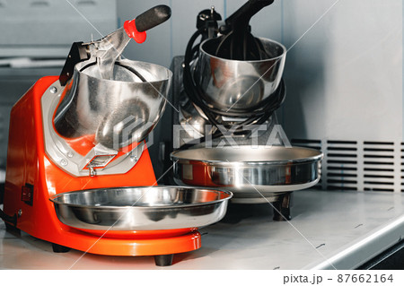 Proffesional new citrus juicers on shelf in a shop Proffesional new citrus juicers on shelf in a shop 87662164