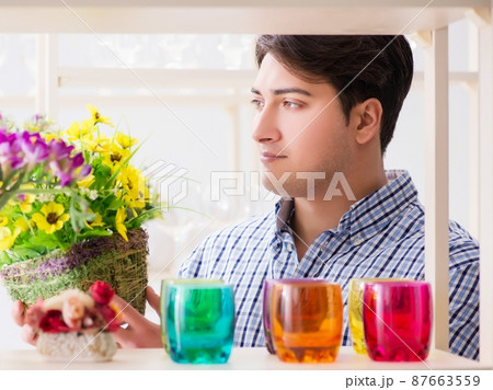 Young handsome man shopping in shop 87663559