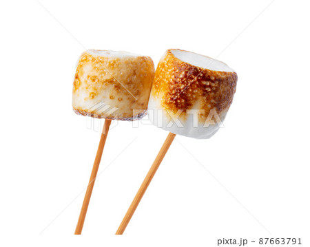 Grilled marshmallows on sticks isolated on white Grilled marshmallows on sticks isolated on white 87663791