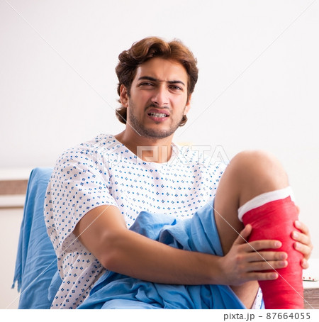 Injured man waiting treatment in the hospital Injured man waiting treatment in the hospital 87664055