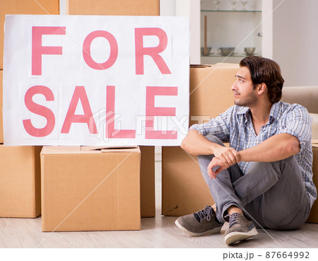 Young man offering home for sale and moving out 87664992