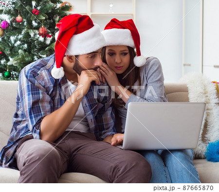 Happy couple celebrating christmas holiday Happy couple celebrating christmas holiday 87665870