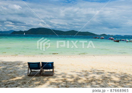 Beach bed chairs on white sand beach at Hey island, Phuket 87668965