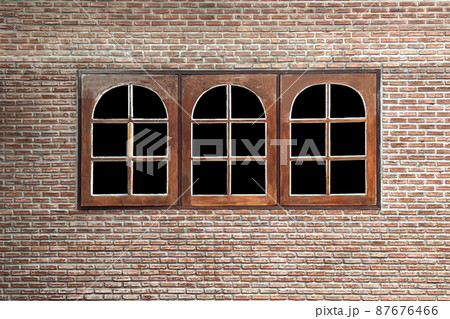 The triple real wood frame window on vintage orange brick wall for home texture background (have path black in window) 87676466