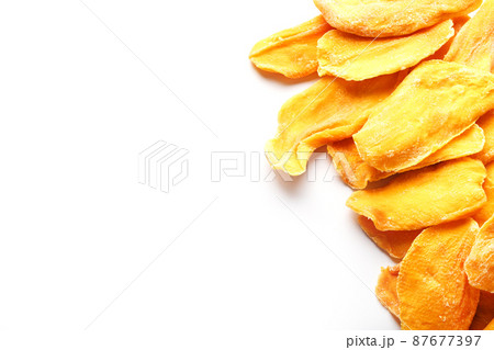 Dried fruit slices from organic ripe mango Dried fruit slices from organic ripe mango 87677397
