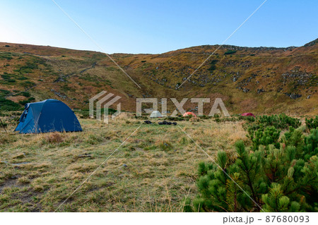 Tent camp near Lake Nesamovyto, morning in a camp town in the mountains. Tent camp near Lake Nesamovyto, morning in a camp town in the mountains. 87680093