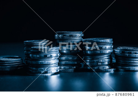 Pile of gold coins money stack in finance treasury deposit bank account saving 87680961