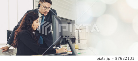 Business people wearing headset working in office broaden view Business people wearing headset working in office broaden view 87682133