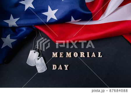 Memorial day concept. American flag and military dog tags on black background. Remember and honor. Memorial day concept. American flag and military dog tags on black background. Remember and honor. 87684088