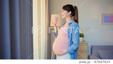 Side view of asian pregnant woman 87687924