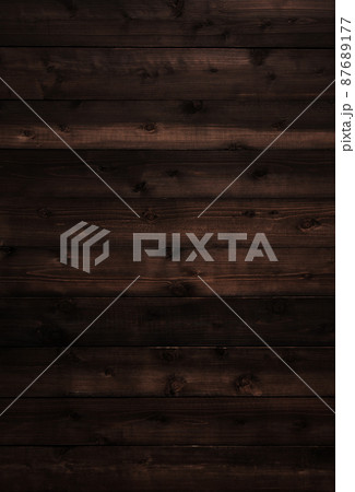木目や節のある黒茶色の板が並ぶ縦長の背景画像 87689177