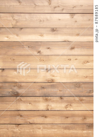 木目や節のある薄茶色の板が並ぶ縦長の背景画像 87689185