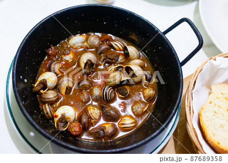 Dish of boiled snails closeup Dish of boiled snails closeup 87689358