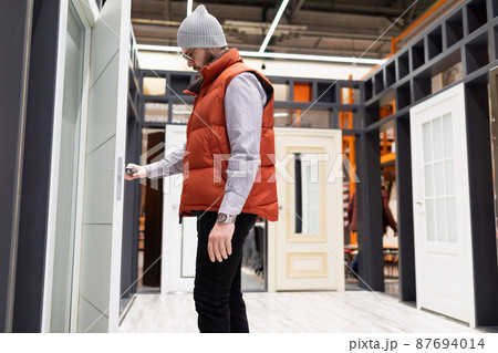 hardware store customer chooses interior doors 87694014