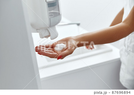 Doctor washing hands before operating in hospital. Health care and hygiene concept 87696894