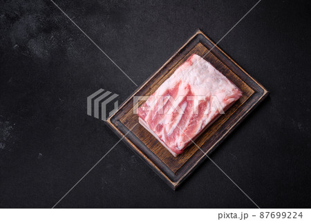 Close-up fat Salted lard homemade lard on a wooden board Close-up fat Salted lard homemade lard on a wooden board 87699224