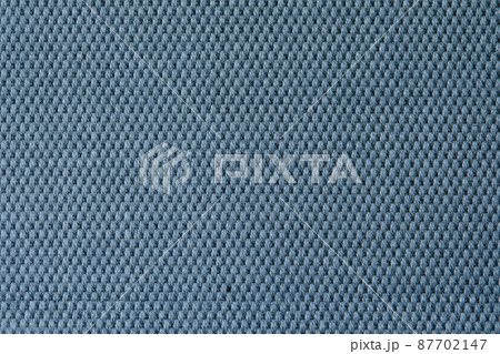 Knitted texture. Texture of jacquard fabric with gray blue geometric pattern. Crochet mosaic pattern. 87702147