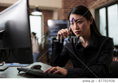 Pensive network engineer reflecting at failed data processing operation 87702936