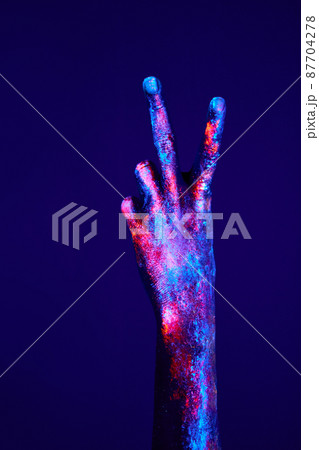 Hand with two fingers up in peace or victory symbol the sign for V letter in sign language 87704278