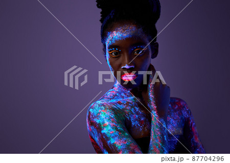 charming black woman hold hands on neck wear no clothes isolated on purple 87704296