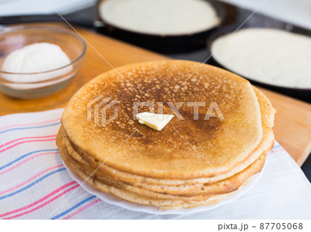 stack of appetizing flour pancakes in the kitchen during cooking stack of appetizing flour pancakes in the kitchen during cooking 87705068