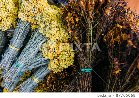 Bunches of fresh medicinal flowers of helichrysum and Hypericum Bunches of fresh medicinal flowers of helichrysum and Hypericum 87705069