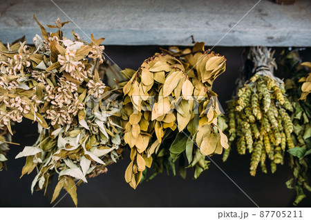 Bunches of dry medicinal plants. Bay leaves, lemongrass are dried Bunches of dry medicinal plants. Bay leaves, lemongrass are dried 87705211