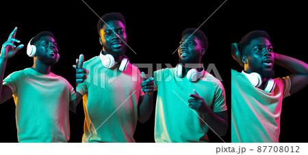 Collage with portraits of young emotional dark skinned man isoaletd on dark background in neon. Concept of human emotions, facial expression, sales. Collage with portraits of young emotional dark skinned man isoaletd on dark background in neon. Concept of human emotions, facial expression, sales. 87708012