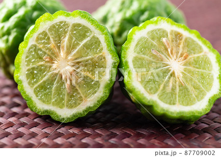 Organic Kaffir lime, Citrus fruit used in Southeast Asian cuisine and essential oil 87709002