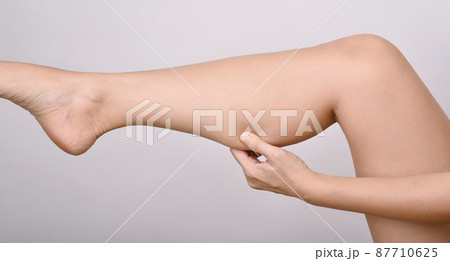 Calf fat, Fat woman pinching thigh leg skin, Overweight body test. Calf fat, Fat woman pinching thigh leg skin, Overweight body test. 87710625
