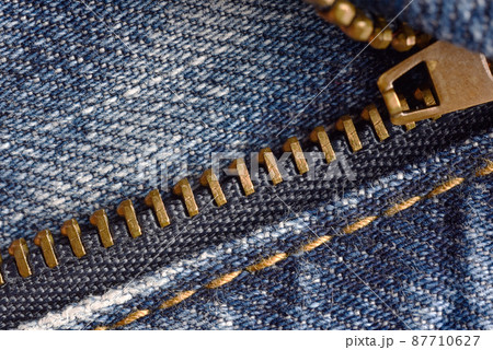 Zipper fastener, Macro of denim jeans pant zipper. Zipper fastener, Macro of denim jeans pant zipper. 87710627