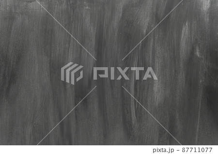 Black painted surface with white streaks. Primed wall. Rough Abstract background. 87711077