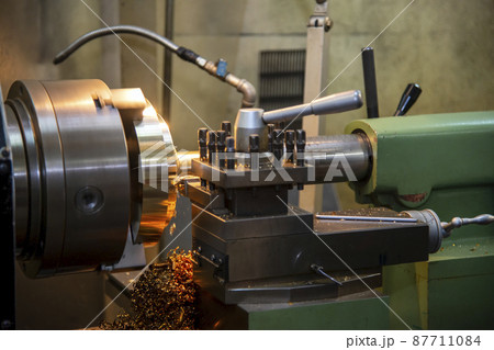 The lathe machine finishing cut the metal disc parts by lathe tools. The lathe machine finishing cut the metal disc parts by lathe tools. 87711084