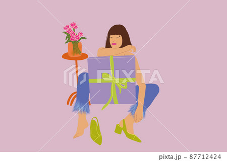 Stylish woman sitting relaxed with a big gift box on background Stylish woman sitting relaxed with a big gift box on background 87712424