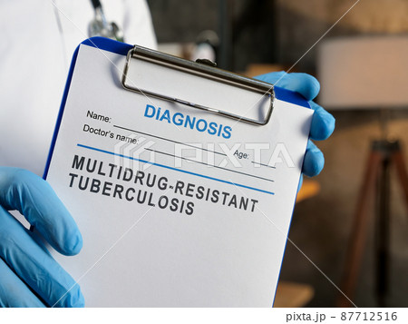 Doctor shows diagnosis Multidrug Resistant Tuberculosis MDR TB. 87712516
