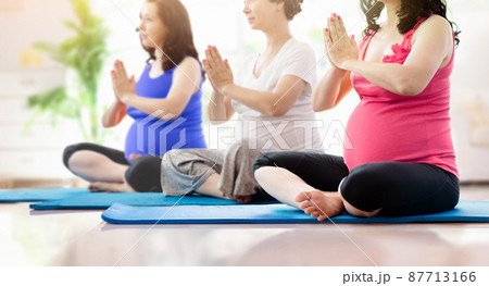 Pregnancy yoga. Exercise for pregnant woman. 87713166