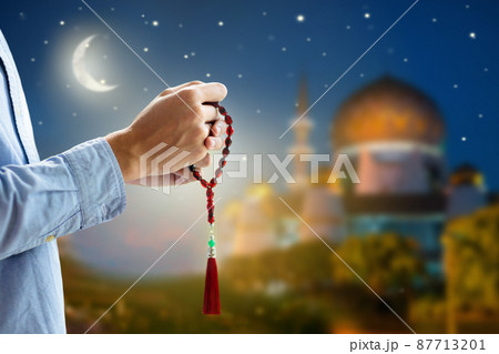 Ramadan Kareem greeting. Man praying. Ramadan Kareem greeting. Man praying. 87713201