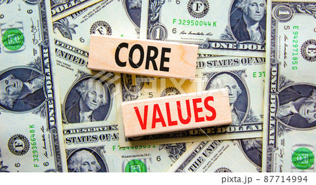 Core values symbol. Concept words Core values on wooden blocks on a beautiful background from dollar bills. Business value and core values concept, copy space. 87714994