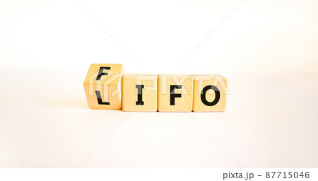 LIFO or FIFO last in first out symbol. Changed concept words LIFO to FIFO on wooden blocks. Beautiful white table white background. Businessman hand. Business LIFO or FIFO concept. Copy space. LIFO or FIFO last in first out symbol. Changed concept words LIFO to FIFO on wooden blocks. Beautiful white table white background. Businessman hand. Business LIFO or FIFO concept. Copy space. 87715046