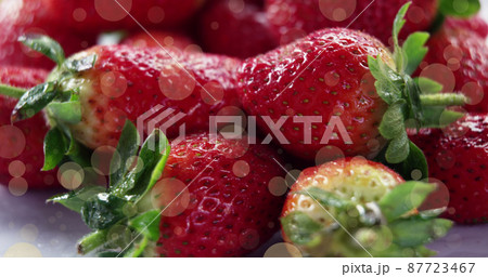 Image of spots over fresh strawberries Image of spots over fresh strawberries 87723467