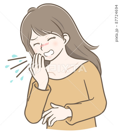 くしゃみをするロングヘアの若い女性 87724694