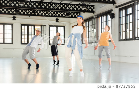 Team of young dancers training moves 87727955