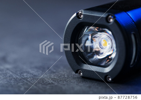 Black Rechargeable Flashlight LED handheld on a black background 87728756