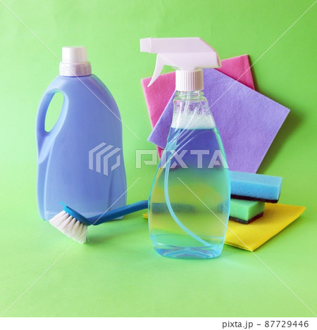 Liquid detergents in plastic bottles, household cleaning products on the table, green background, the concept of cleaning, order, cleanliness, home delivery Liquid detergents in plastic bottles, household cleaning products on the table, green background, the concept of cleaning, order, cleanliness, home delivery 87729446