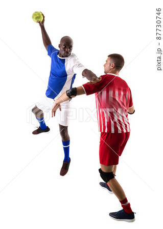 Young multiracial male players playing handball against white background Young multiracial male players playing handball against white background 87730746