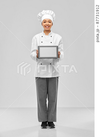 smiling female chef with tablet computer smiling female chef with tablet computer 87731912